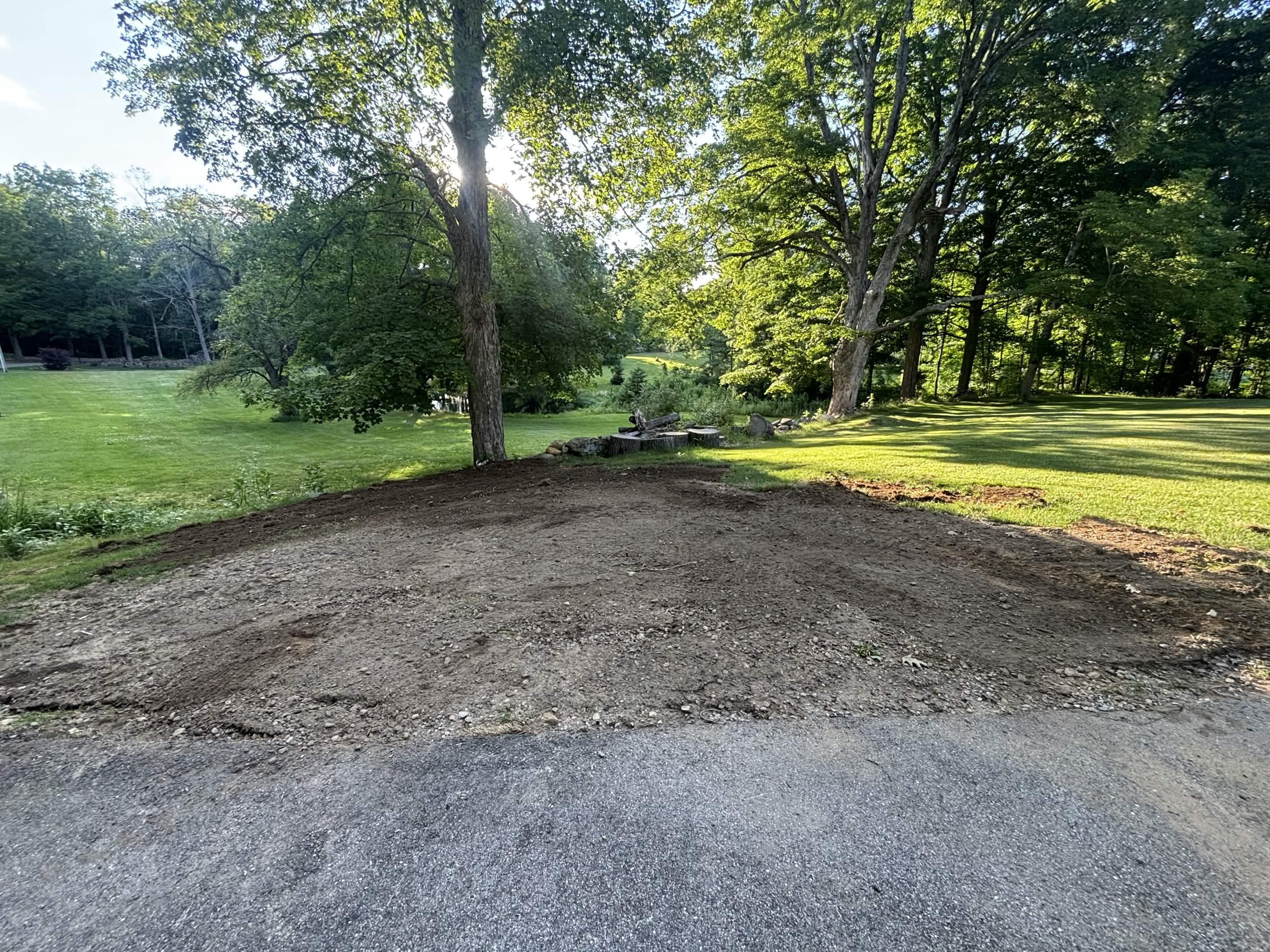 Finished yard after drainage repair and loam installation — Spencer, MA